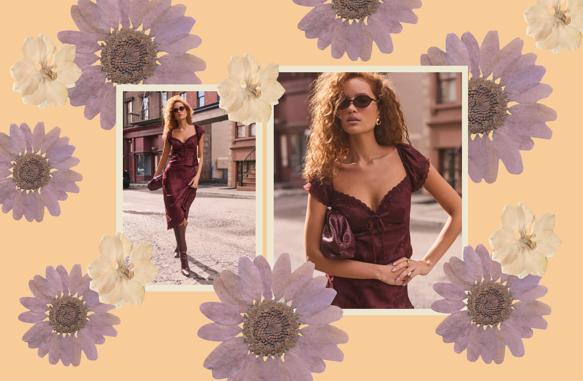 A fashion collage on a warm peach background decorated with large purple and cream flowers. Two inset photos show a woman wearing a dark burgundy off-the-shoulder dress with puff sleeves and a sweetheart neckline, styled with sunglasses and a matching han