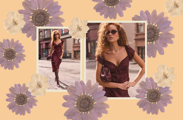 A fashion collage on a warm peach background decorated with large purple and cream flowers. Two inset photos show a woman wearing a dark burgundy off-the-shoulder dress with puff sleeves and a sweetheart neckline, styled with sunglasses and a matching han