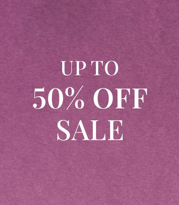 White text on a purple background reading "Up to 50% off sale".