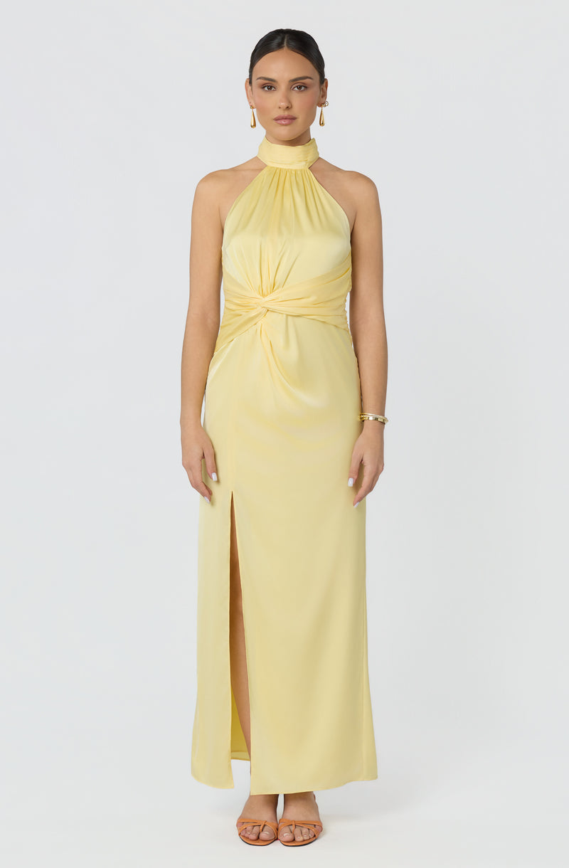 Yellow sleeveless halter maxi dress with a front slit and gathered waist detail.