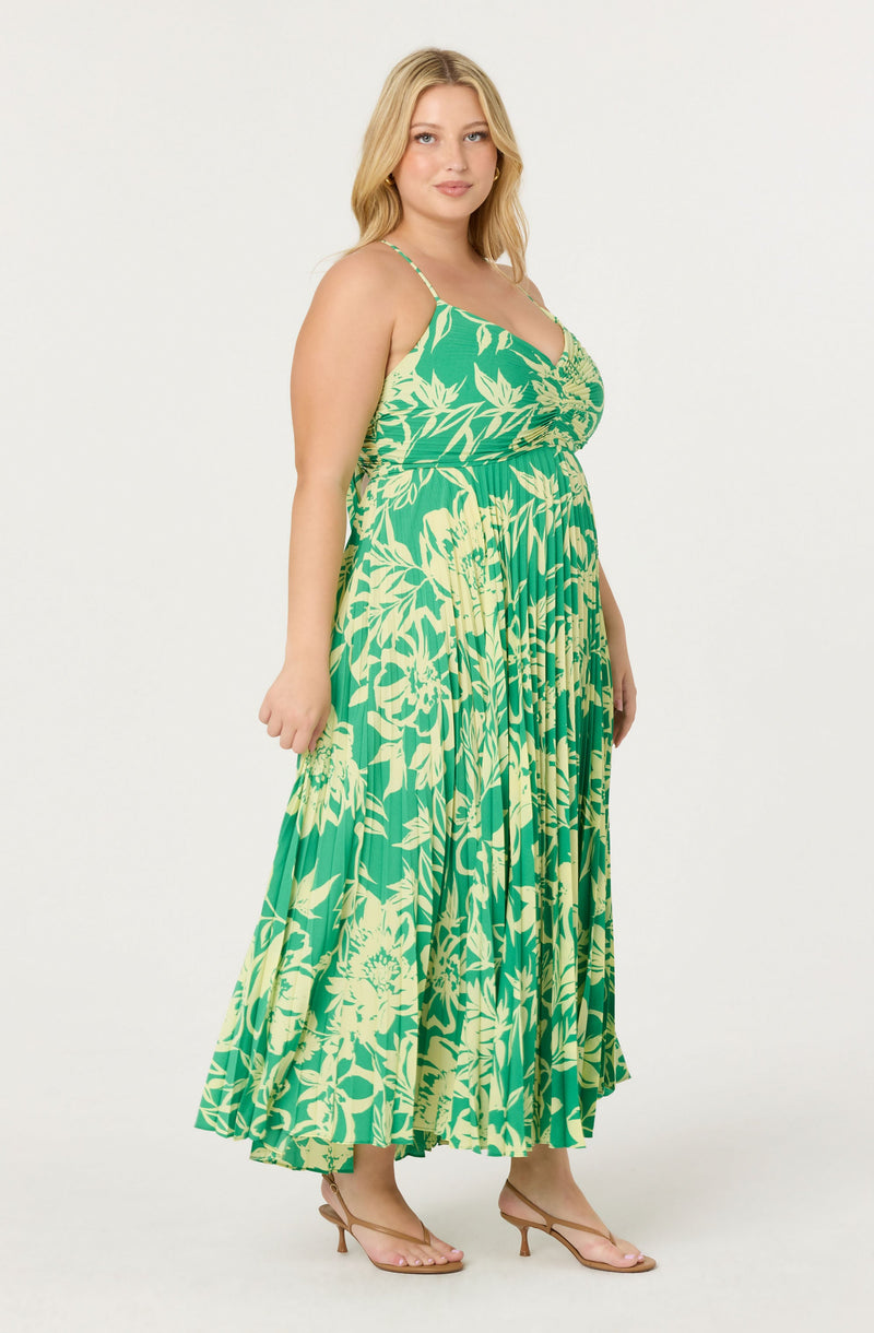 Green and yellow floral maxi dress with spaghetti straps and a flowy skirt.