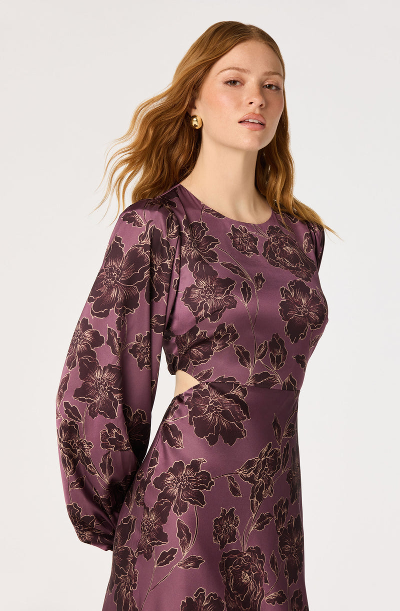 Purple satin dress with long puffed sleeves and black floral pattern.