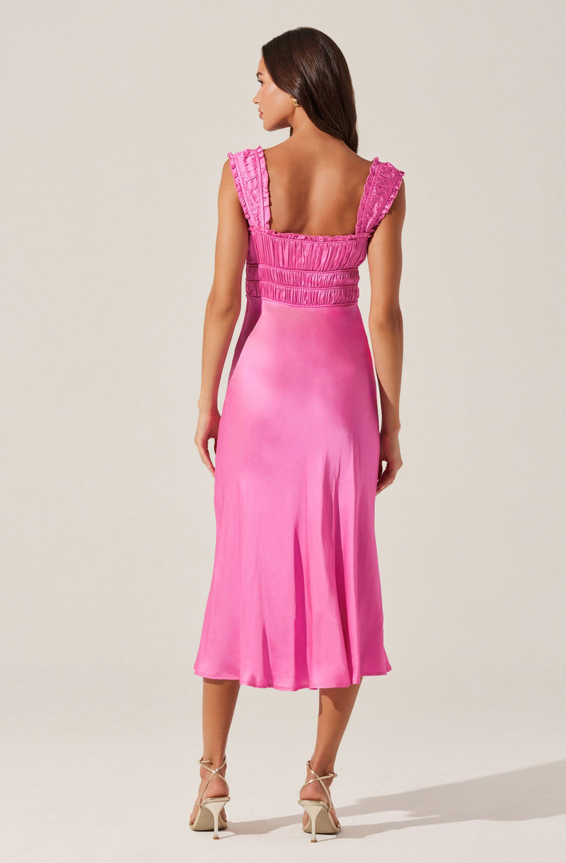 The dress is a vibrant pink, sleeveless design with wide, ruffled shoulder straps. The top features horizontal ruching details down the bodice, creating a textured look. The skirt is a smooth, flowing fabric that falls mid-calf length with a slight flare. The overall style is elegant and feminine, suitable for formal occasions.