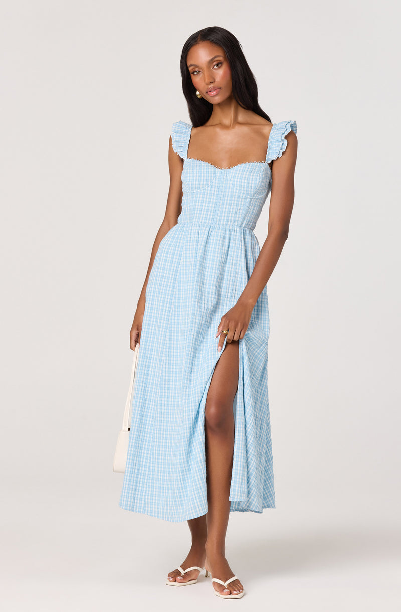 Light blue gingham maxi dress with ruffled shoulder straps and side slit.