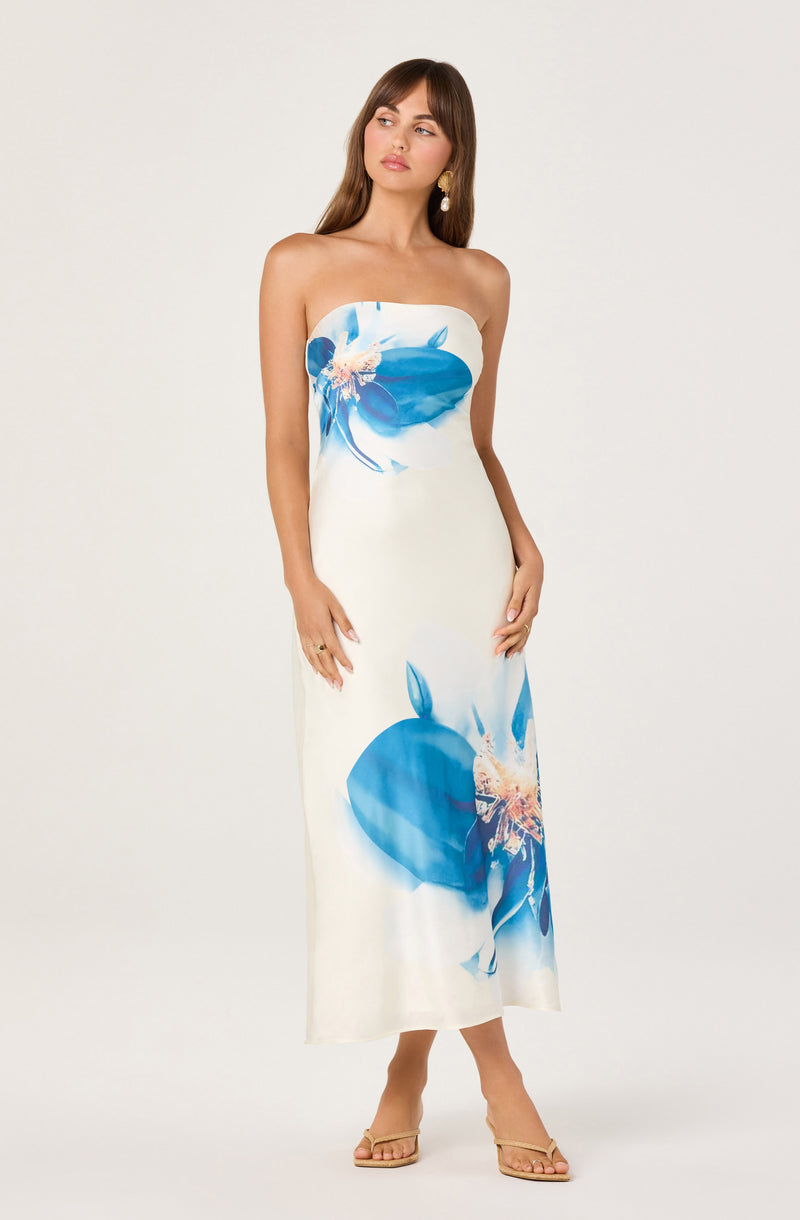 White strapless dress with large blue floral prints.