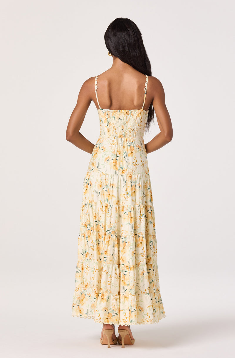 Long floral maxi dress with thin, wavy straps and a smocked bodice.
