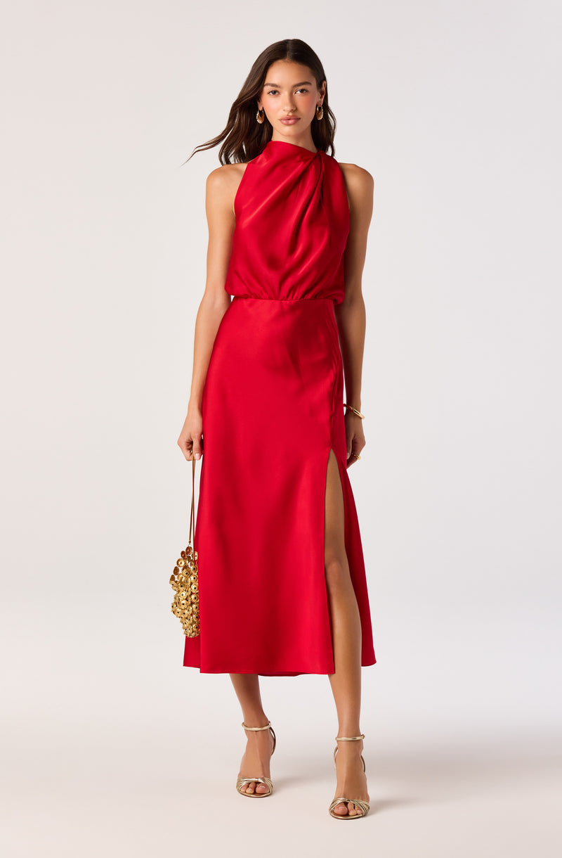 Red sleeveless satin dress with a high slit on the left side, pleated bodice, and gathered waist.