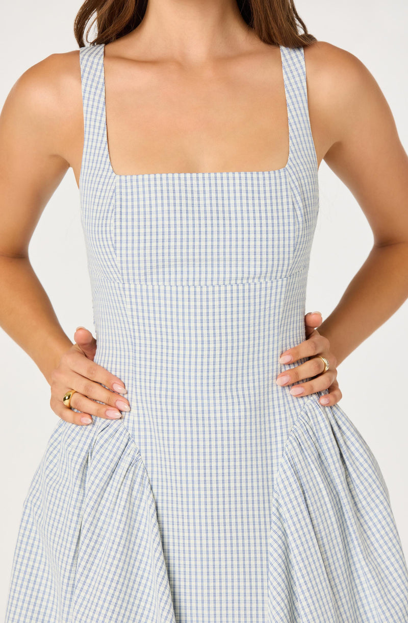 Light blue and white checkered sleeveless dress with a square neckline.