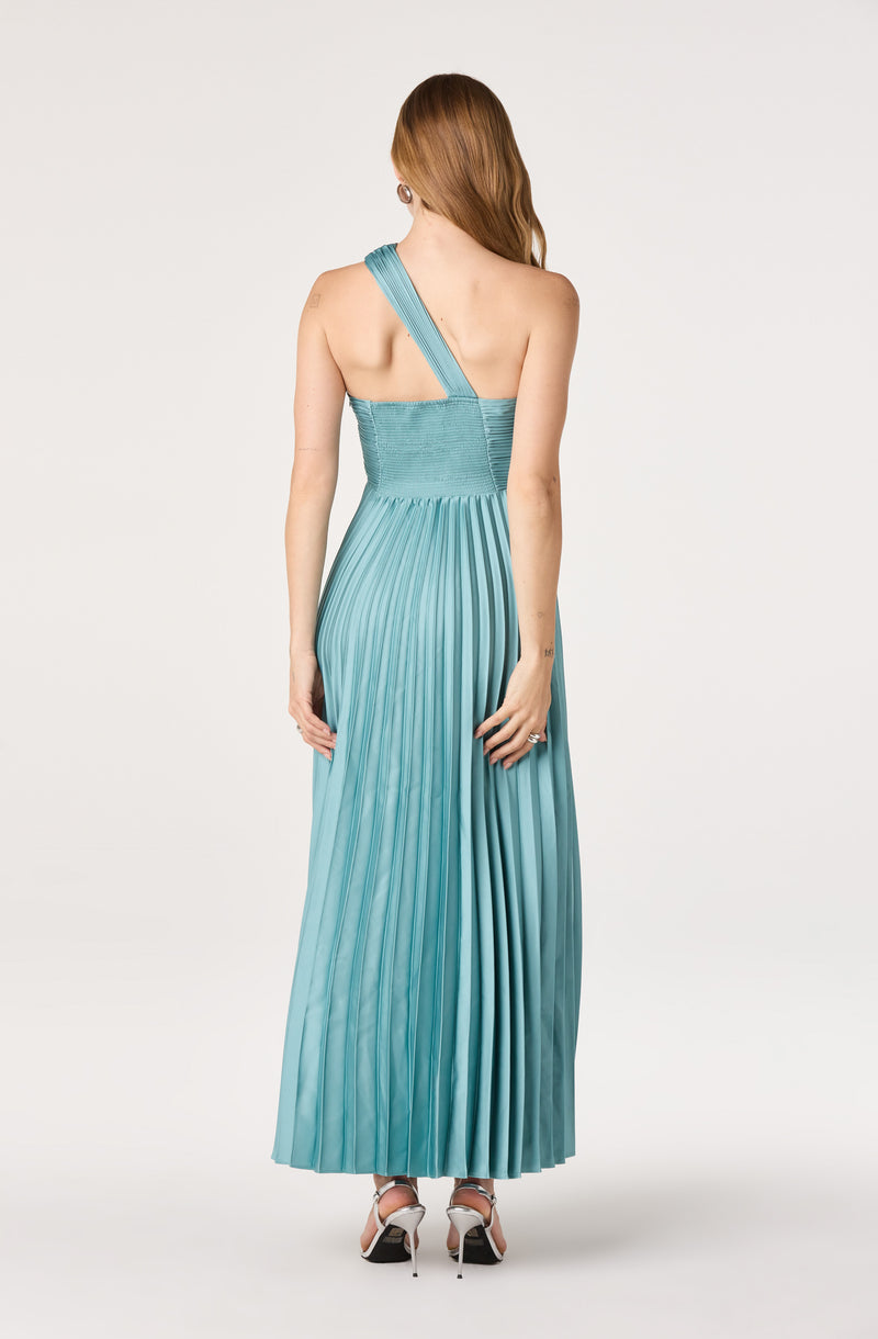 Woman in a teal pleated, one-shoulder gown with ruched bodice, back view.
