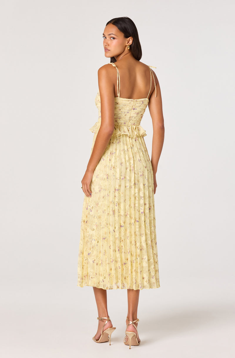 Yellow floral pleated dress with spaghetti straps and ruffle waist.