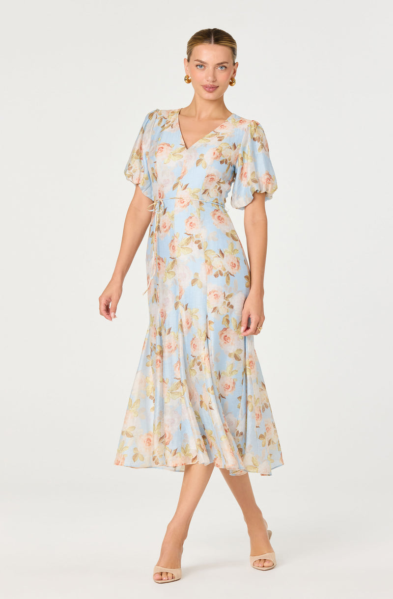 Light blue floral dress with short puff sleeves, V-neckline, and a flowy midi-length skirt.
