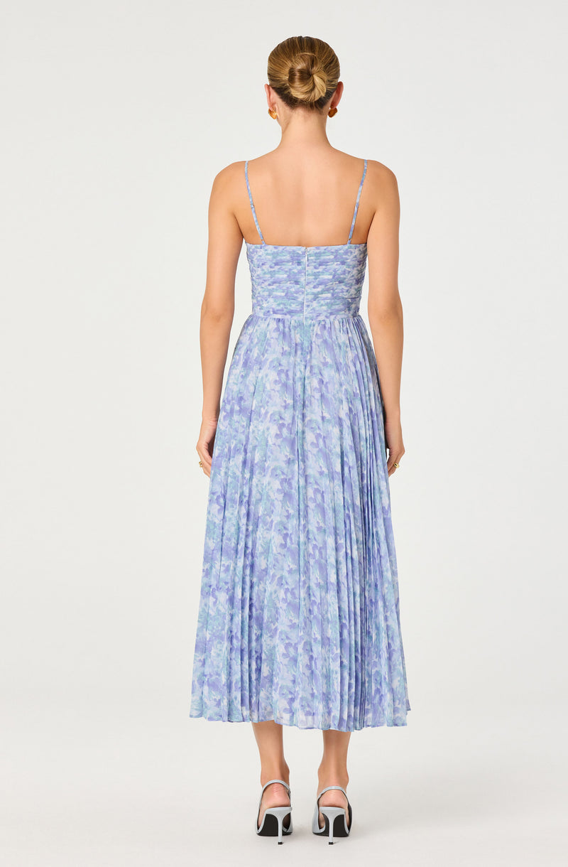 Light purple and blue floral print dress with thin spaghetti straps and pleated skirt.
