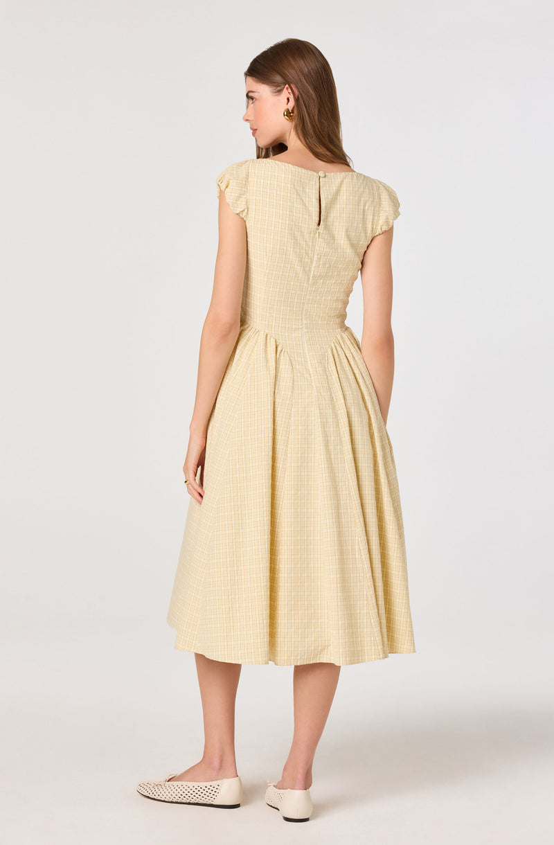 Light yellow checkered dress with puffed short sleeves and a midi length.