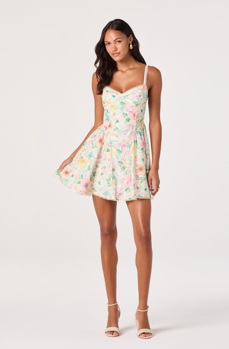 Sleeveless floral dress with spaghetti straps and a ruffled hem.