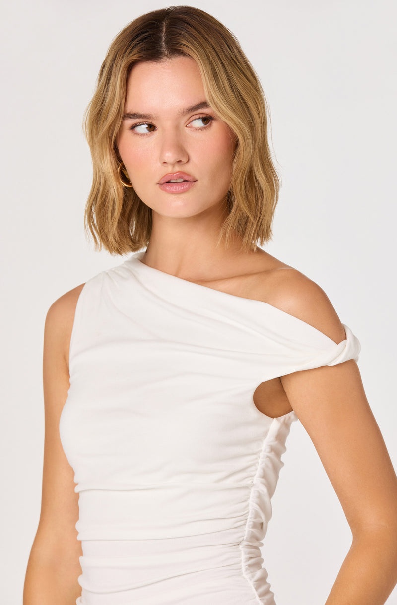 White sleeveless dress with draped and ruched fabric featuring an off-shoulder detail.