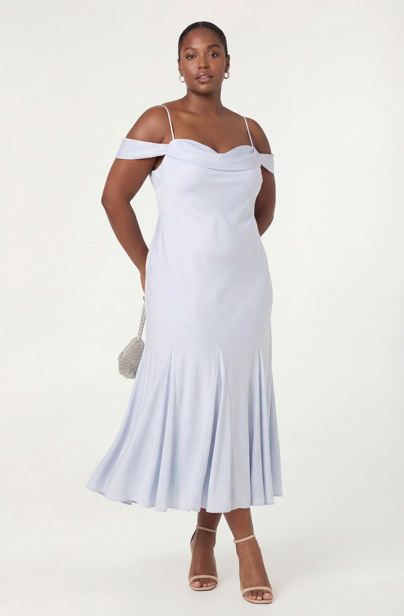 White off-shoulder dress with spaghetti straps and a pleated hem.