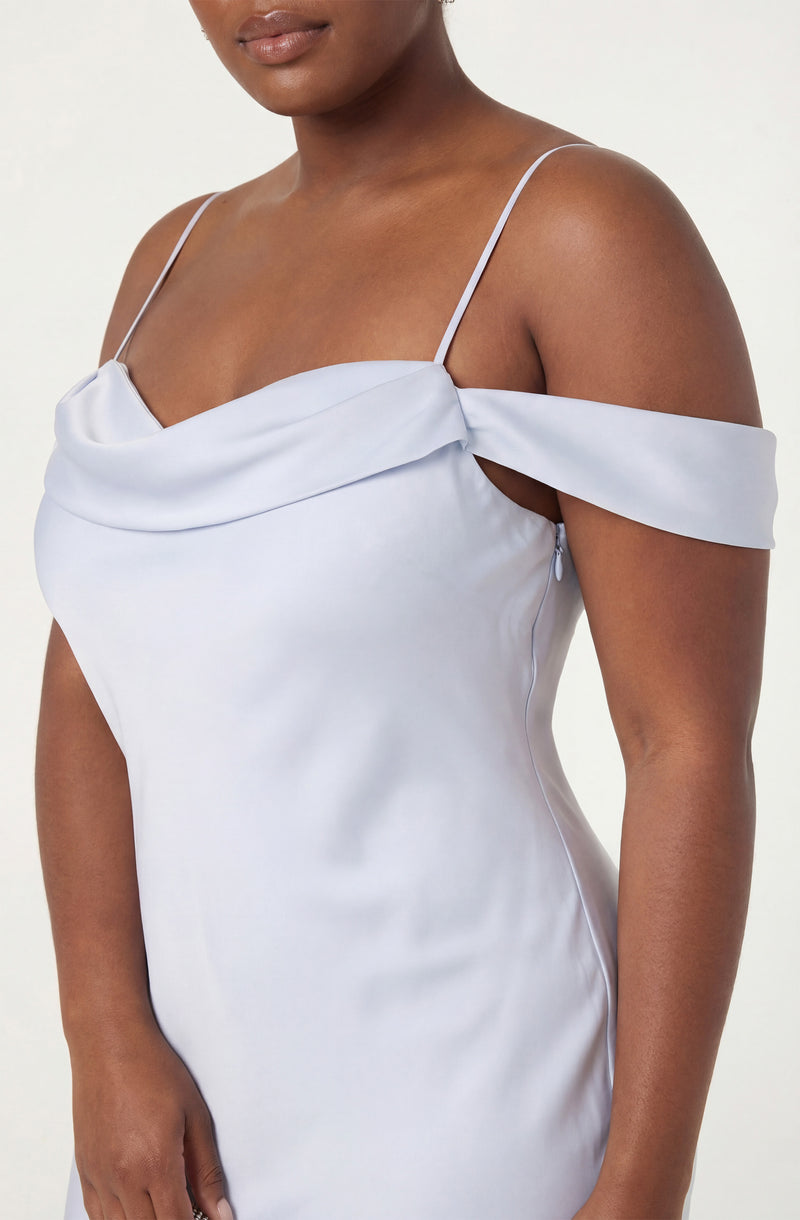 Light blue off-the-shoulder dress with thin spaghetti straps and draped neckline.
