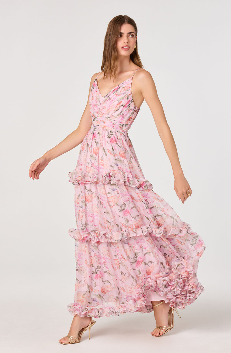 Pink floral maxi dress with ruffle accents and a V-neckline.