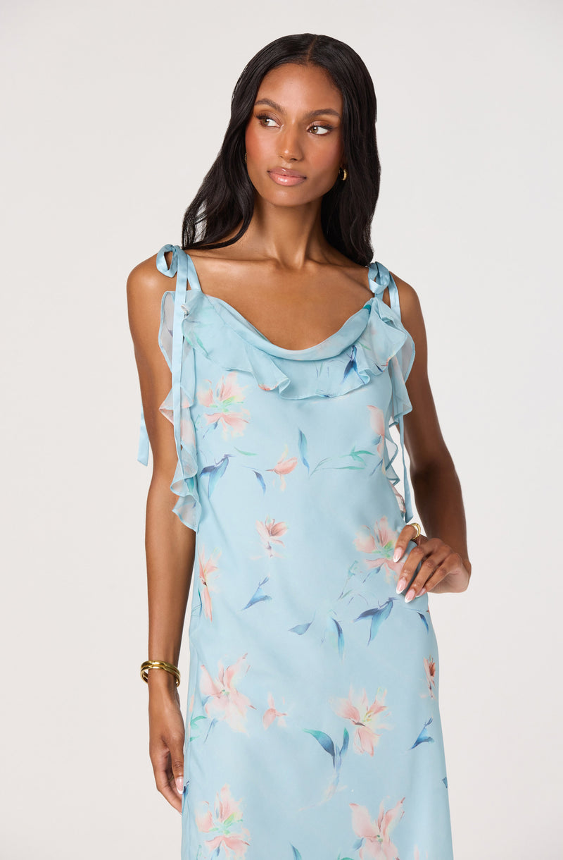 Light blue dress with ruffled shoulder straps and a floral pattern.