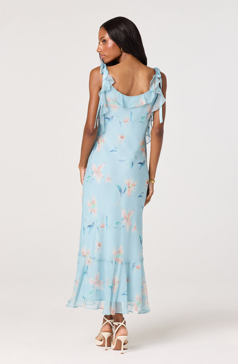 Light blue floral maxi dress with ruffled shoulder straps and bow details.