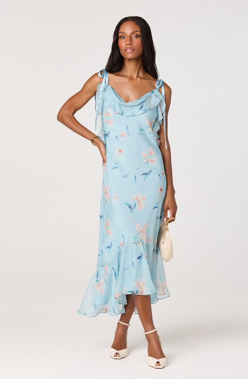 Light blue floral dress with ruffled neckline and shoulder ties.