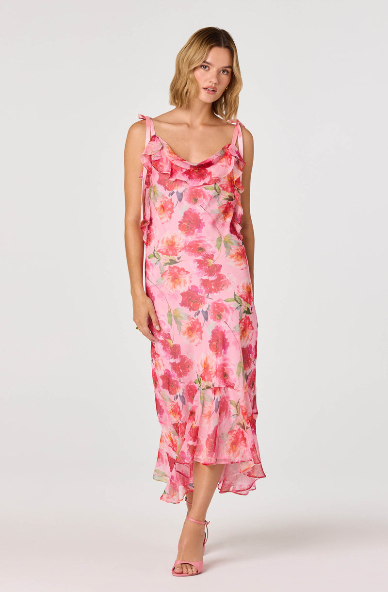 Pink floral slip dress with ruffled shoulder straps and a ruffled hem.