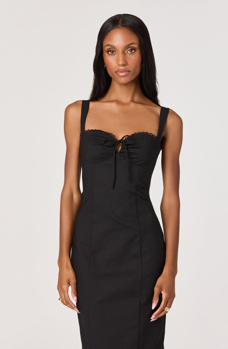 Black sleeveless dress with wide straps, a keyhole detail, and a fitted silhouette.