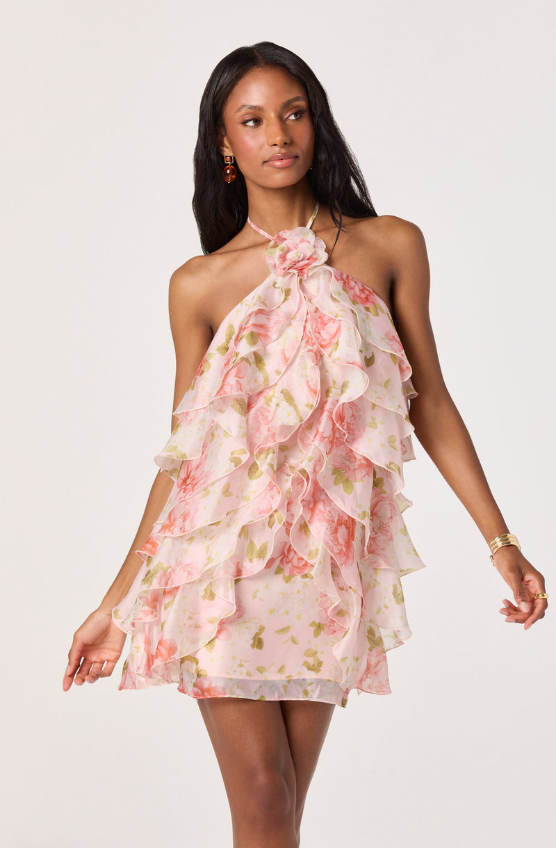 Sleeveless floral dress with ruffled layers and a bow at the neckline.