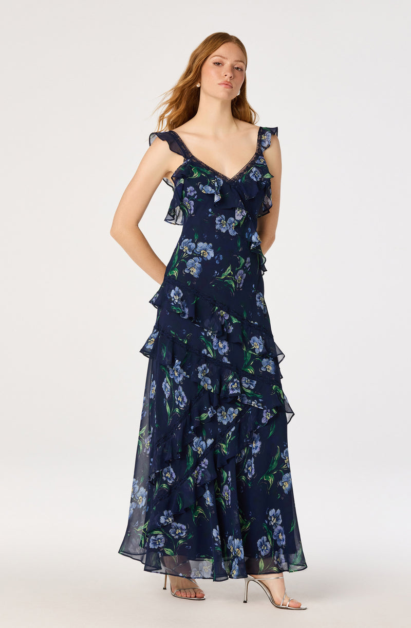 Navy blue floral dress with ruffles and shoulder straps, ankle length, sheer fabric.