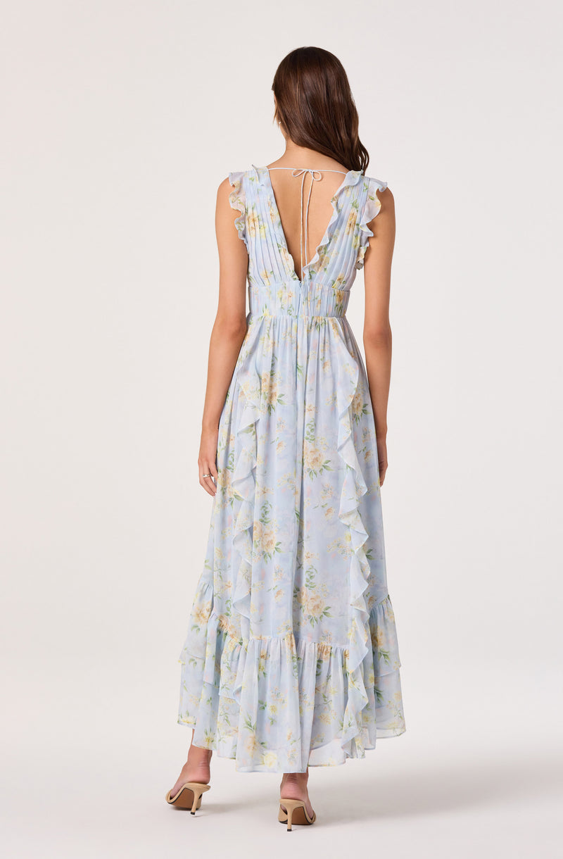 Light blue floral maxi dress with ruffled sleeves and a deep V back with tie detail.