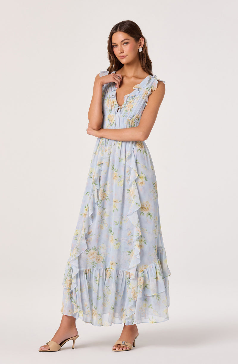 Sleeveless floral maxi dress with ruffles and a light blue and yellow pattern.