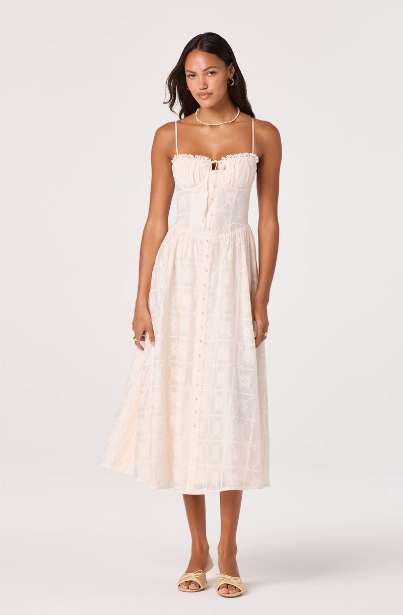 Cream-colored, strappy midi dress with a fitted bust and button-down skirt.