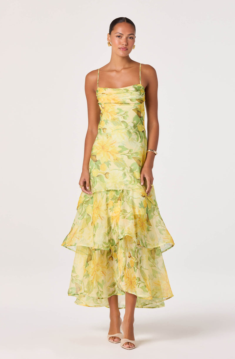 Yellow floral spaghetti strap midi dress with ruffled layered hem.