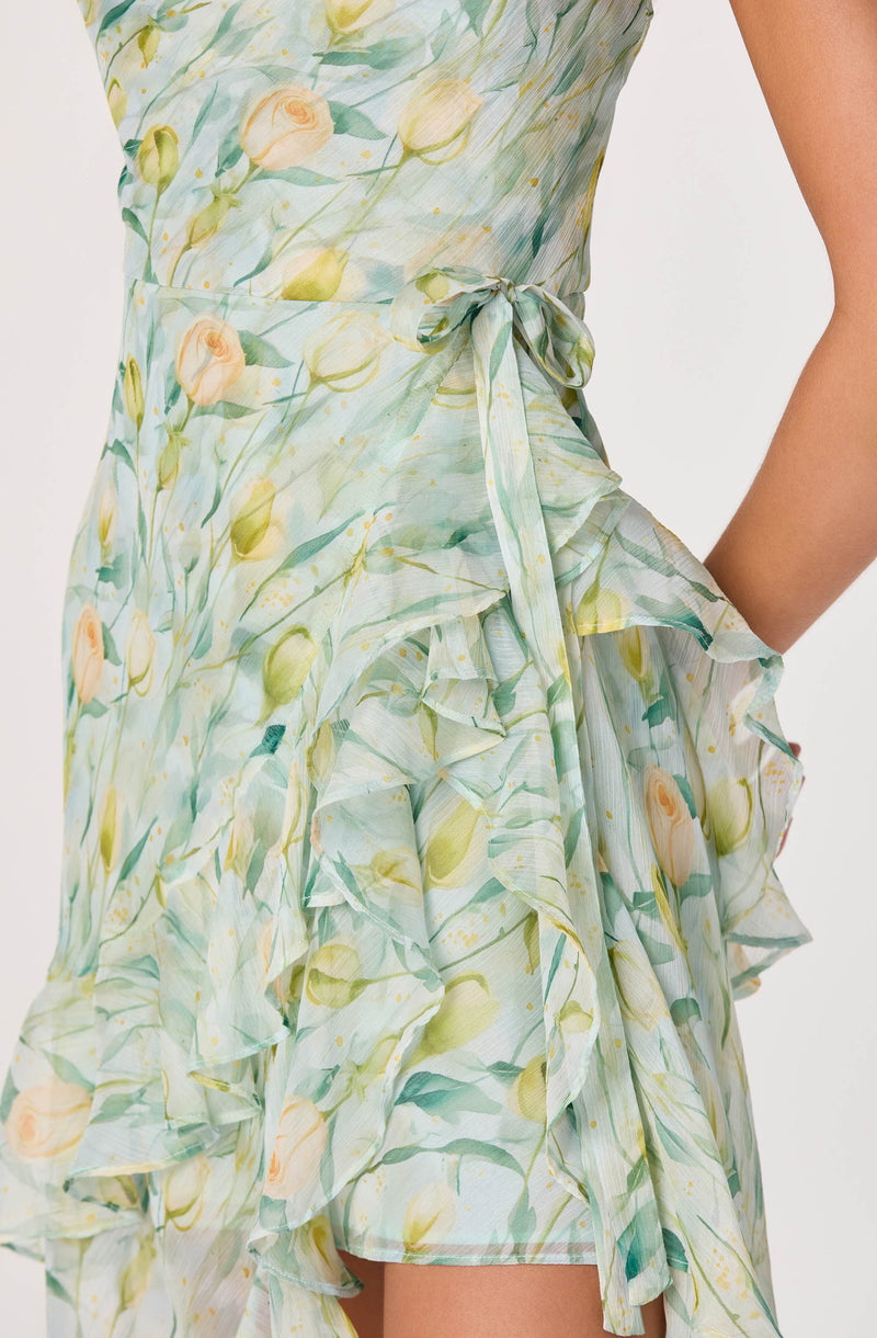 Light green and yellow floral dress with ruffles and a waist tie.