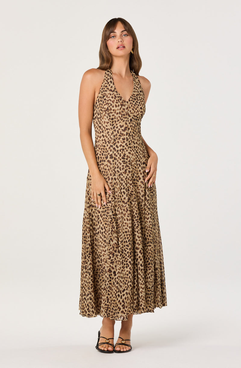 Woman in a sleeveless leopard-print maxi dress with a V-neck.