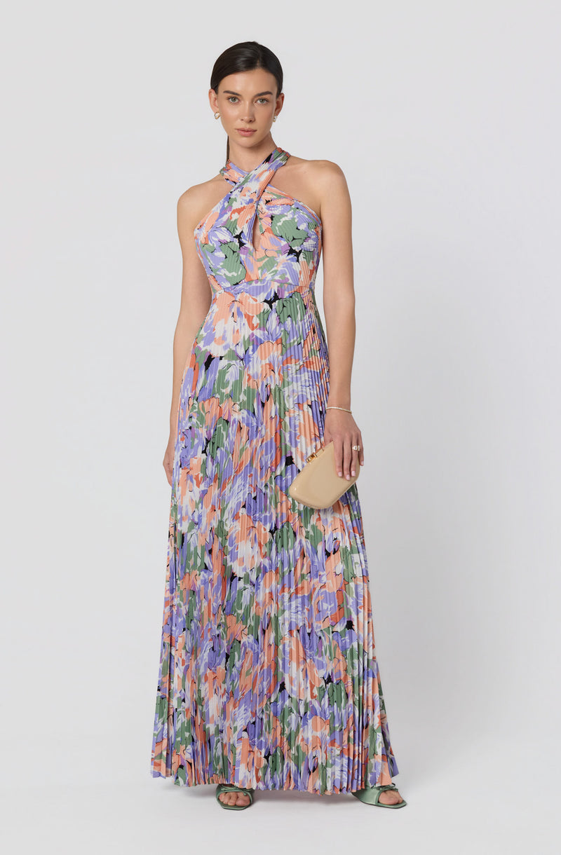 Sleeveless floral maxi dress with a halter neckline and ruffled shoulder strap.