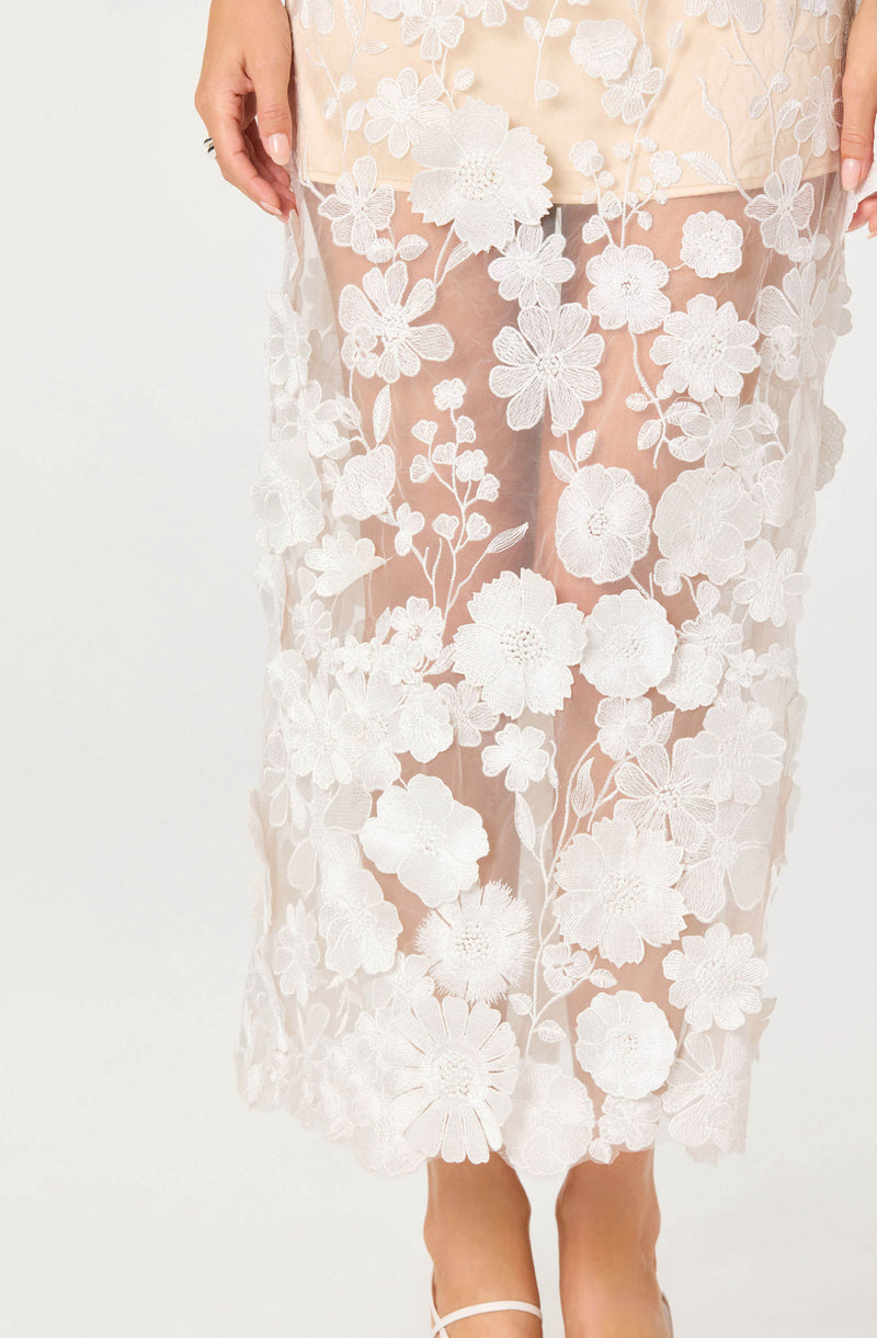 Sheer floral lace skirt with white embroidered flowers and a scalloped hem.