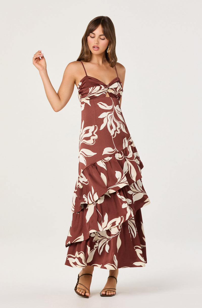 Brown dress with white floral pattern and ruffle tiers, spaghetti straps, and a sweetheart neckline.