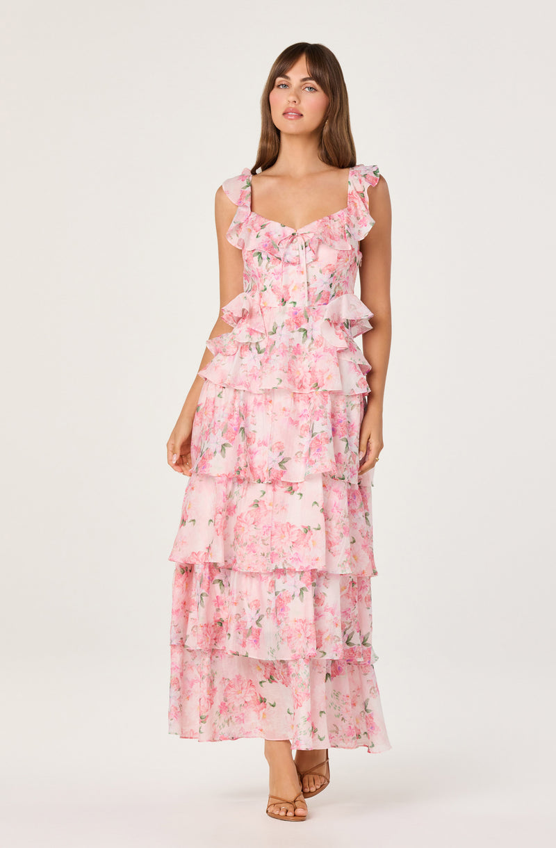 Pink floral tiered maxi dress with ruffled straps and layered ruffle details.
