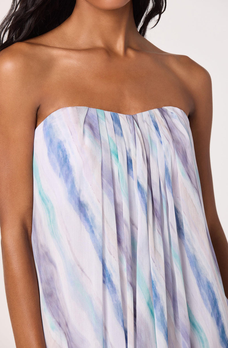 Strapless dress with a watercolor pattern in blue, purple, and white hues.