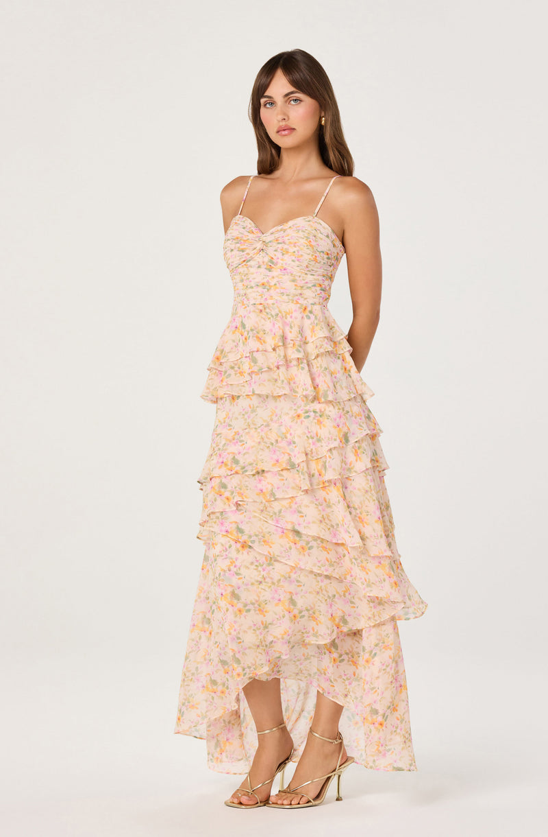 Dress with a floral pattern, tiered ruffles, and spaghetti straps.