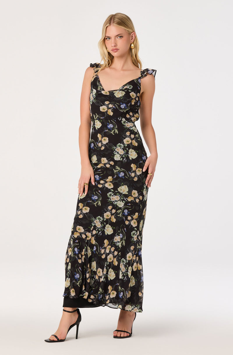 Black floral maxi dress with ruffled shoulder straps and beige, blue, and green flower print.
