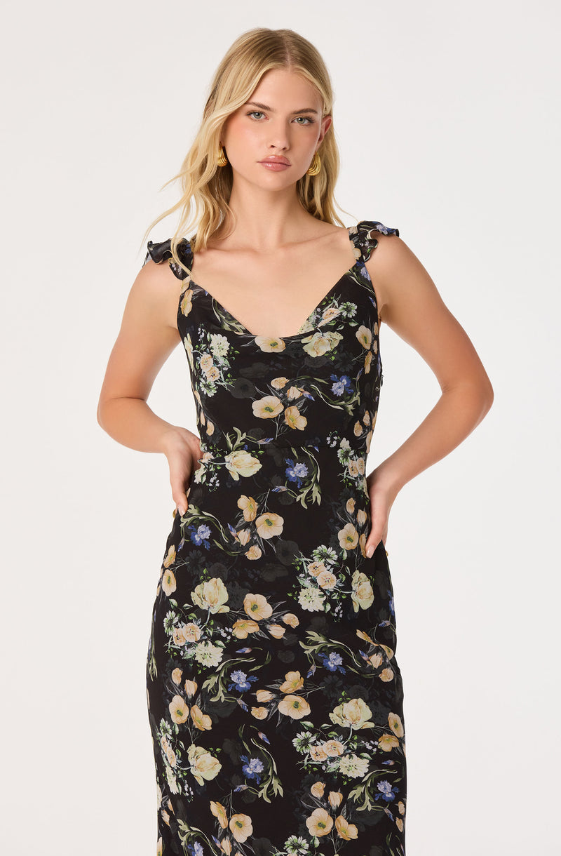 Black floral sleeveless dress with ruffle shoulder straps and a fitted silhouette.