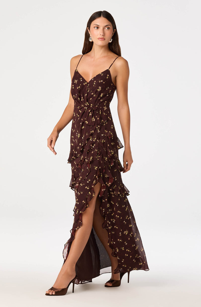 Brown dress with spaghetti straps, floral pattern, ruffled front and high slit.