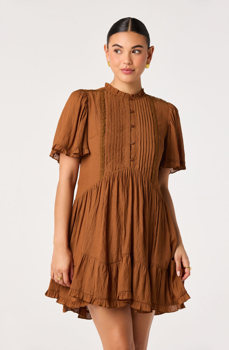 Brown short-sleeve dress with puffed sleeves, buttoned front, and ruffled skirt.