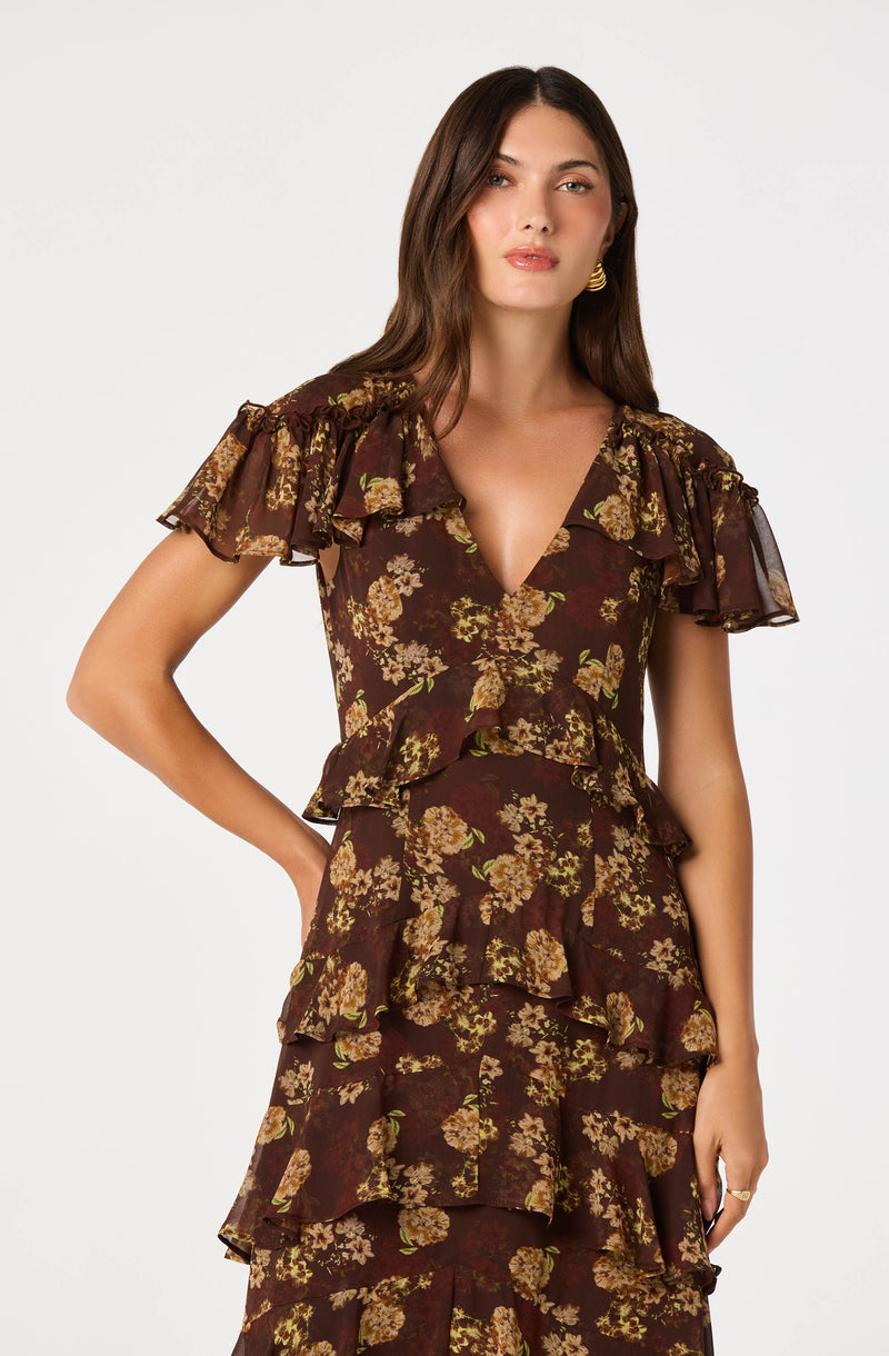 Brown floral dress with layered ruffled sleeves and tiered ruffle skirt.