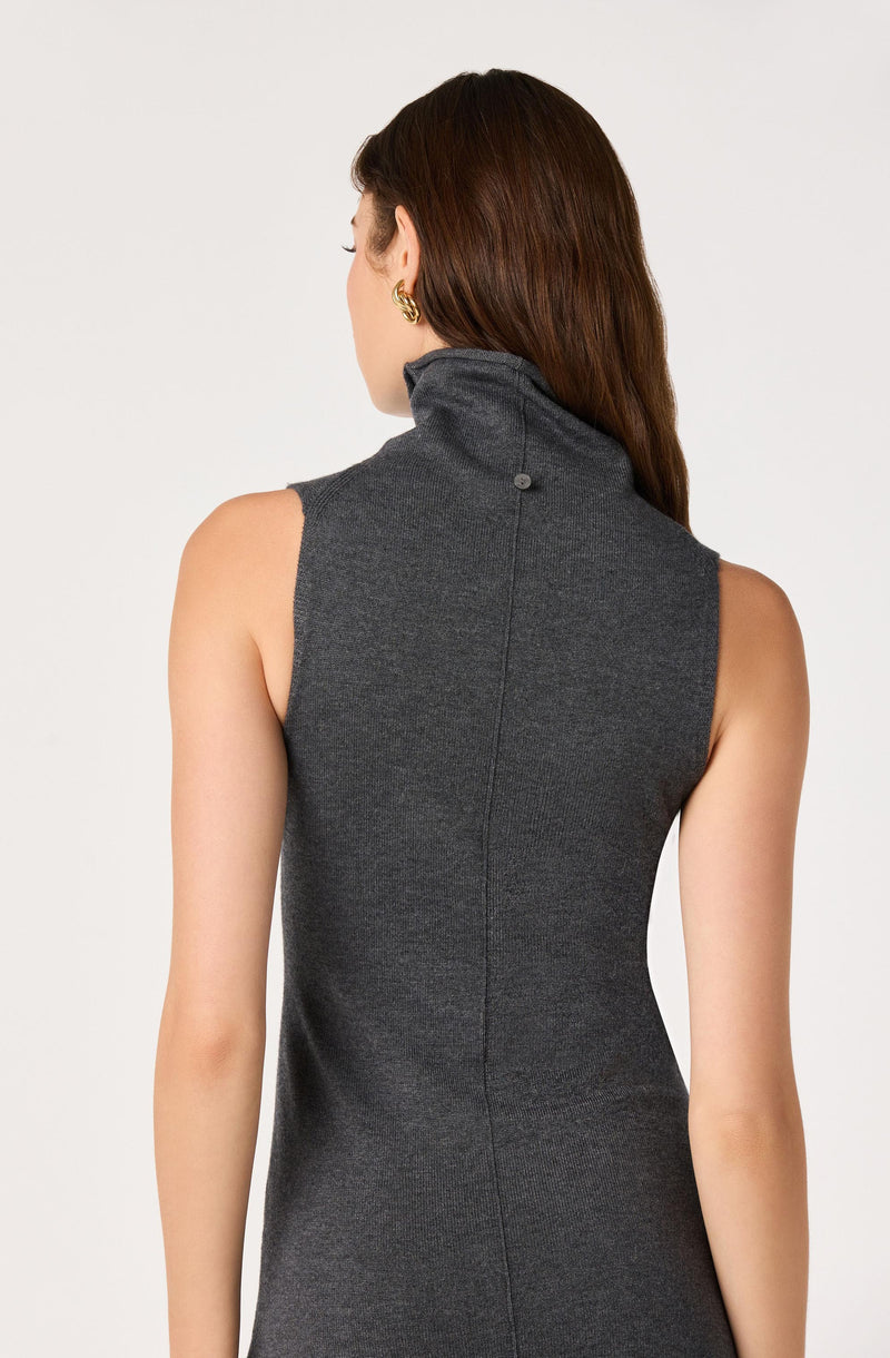 Women's sleeveless gray turtleneck dress, side view, no visible sleeves.