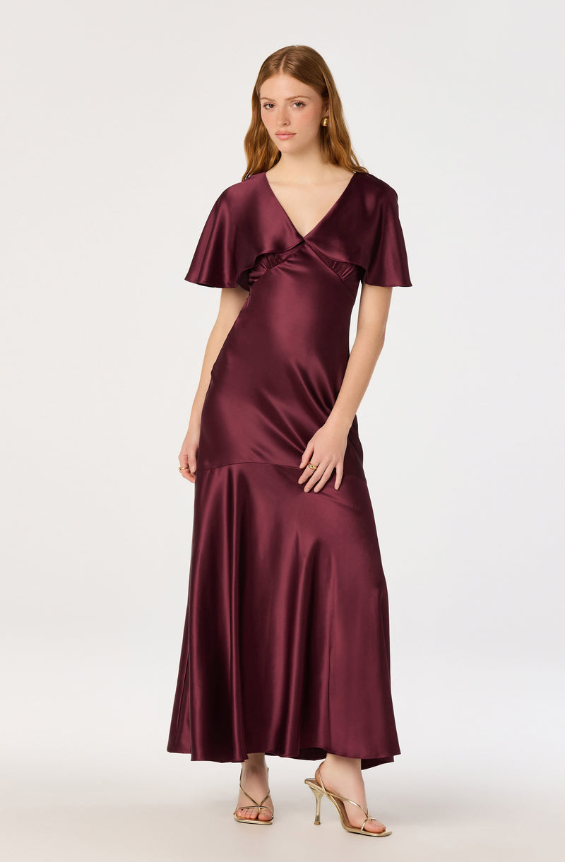Long burgundy satin dress with short, flared sleeves and a V-neckline.