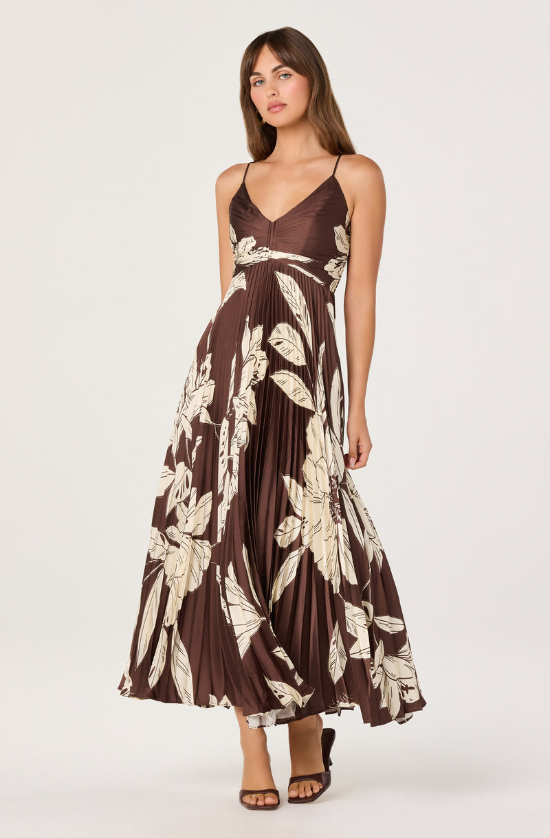 Brown dress with thin straps and a beige floral pattern.