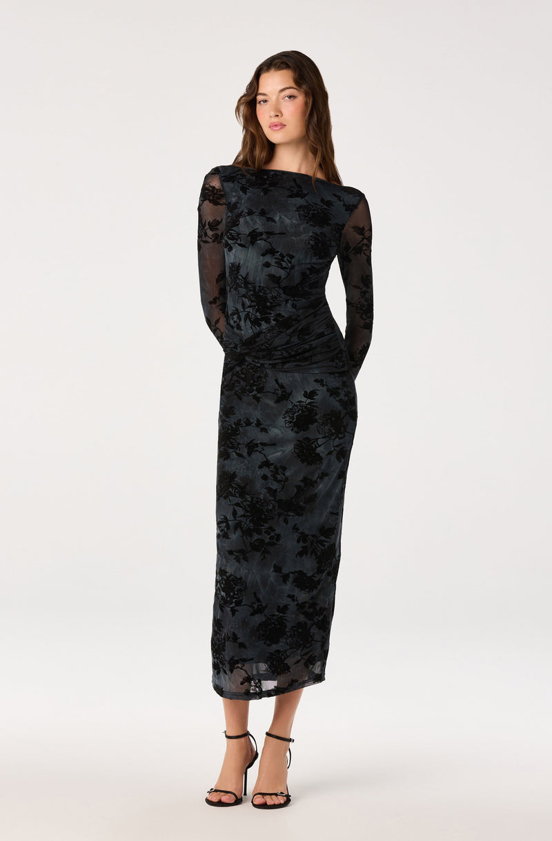 Black floral lace dress with long sheer sleeves and a fitted silhouette.
